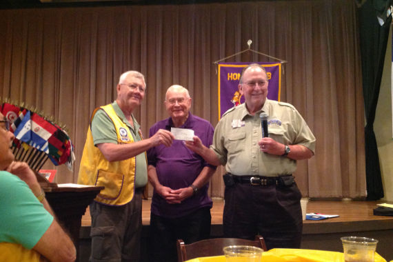 New Braunfels Noon Lions Club donates check to the 100 Club of Comal County